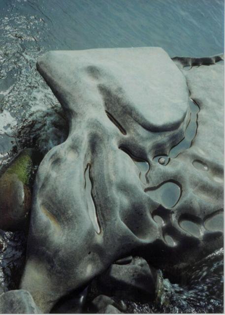 Small linked holes in a boulder